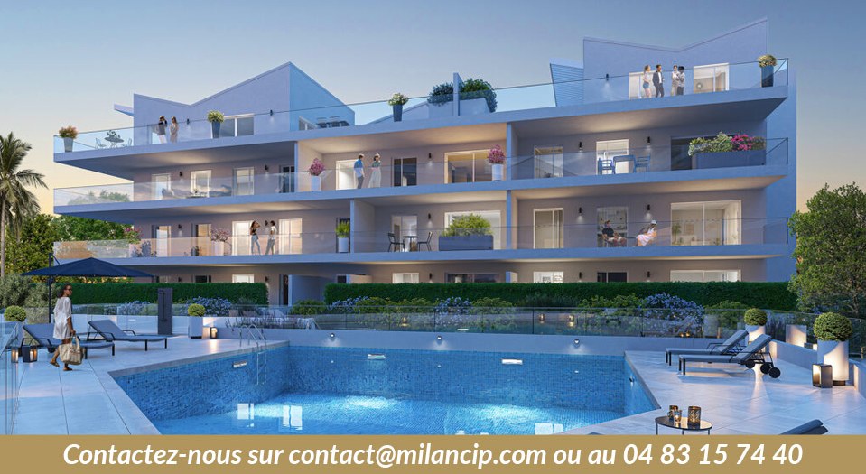 Appartements neufs Cannes Californie — piscine collective et balcons illuminés en soirée